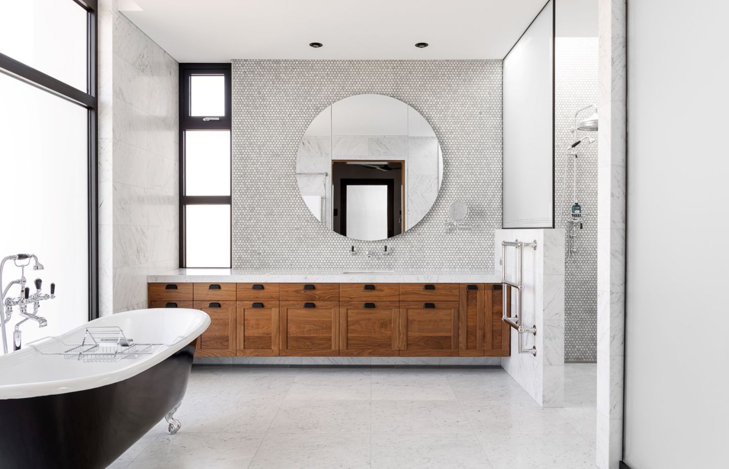 Attention to detail was so crucial in this project that the walnut cabinetry had to be entirely replaced when one cabinet front was damaged, due to the continuous grain that runs across it.