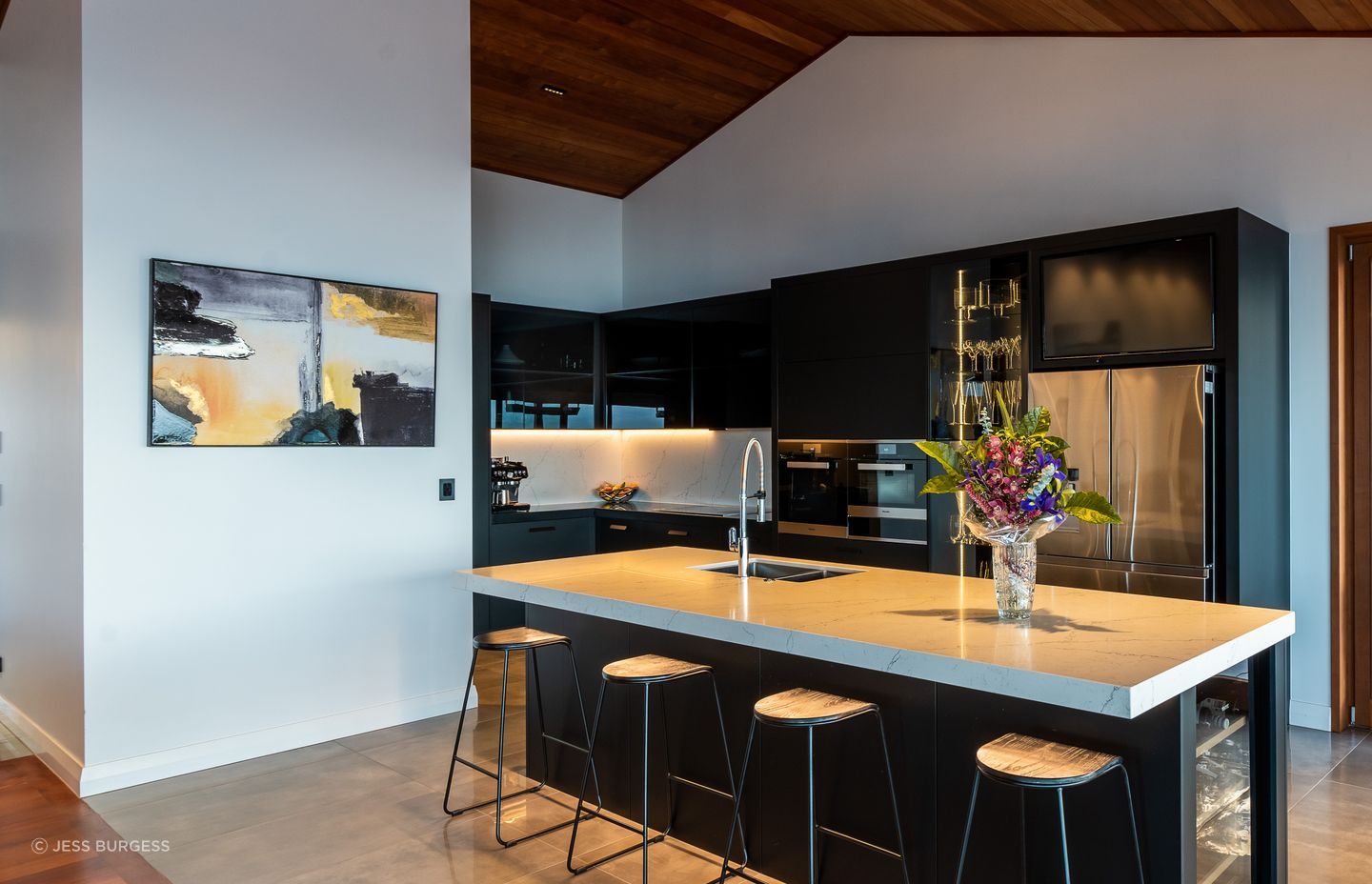 The ovens in the kitchen are by Miele and the fridge is by Samsung. With a glassware display cabinet, two dishwashers and a Vintec wine fridge, it's a house made for entertaining.