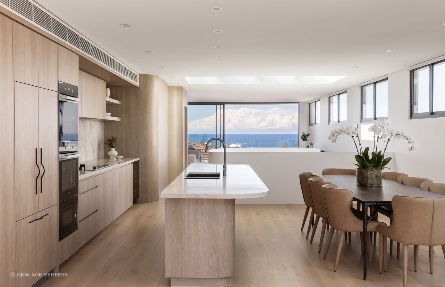 Clovelly House, NSW:
Avenue One Design and Deluxe Joinery utilised Navurban timber alternative in Oak Beach to the curves of the kitchen design creating a coastal air to the space.