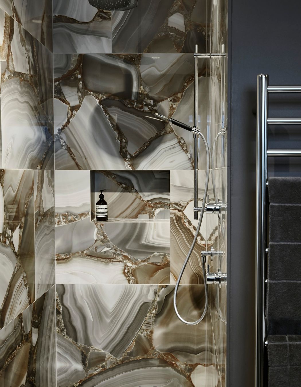 The en suite was a dark room, says Pip Maxwell of Pip Maxwell Interior Design. “Because we painted the walls as well and really embraced it, it highlights the tile as well.” The Buddy tapware in chrome is from Plumbline. Image Jackie Meiring