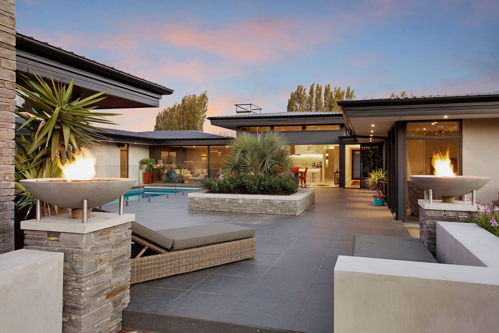 Schist stone has been used in a number of areas, complementing the neutral palette of the home.