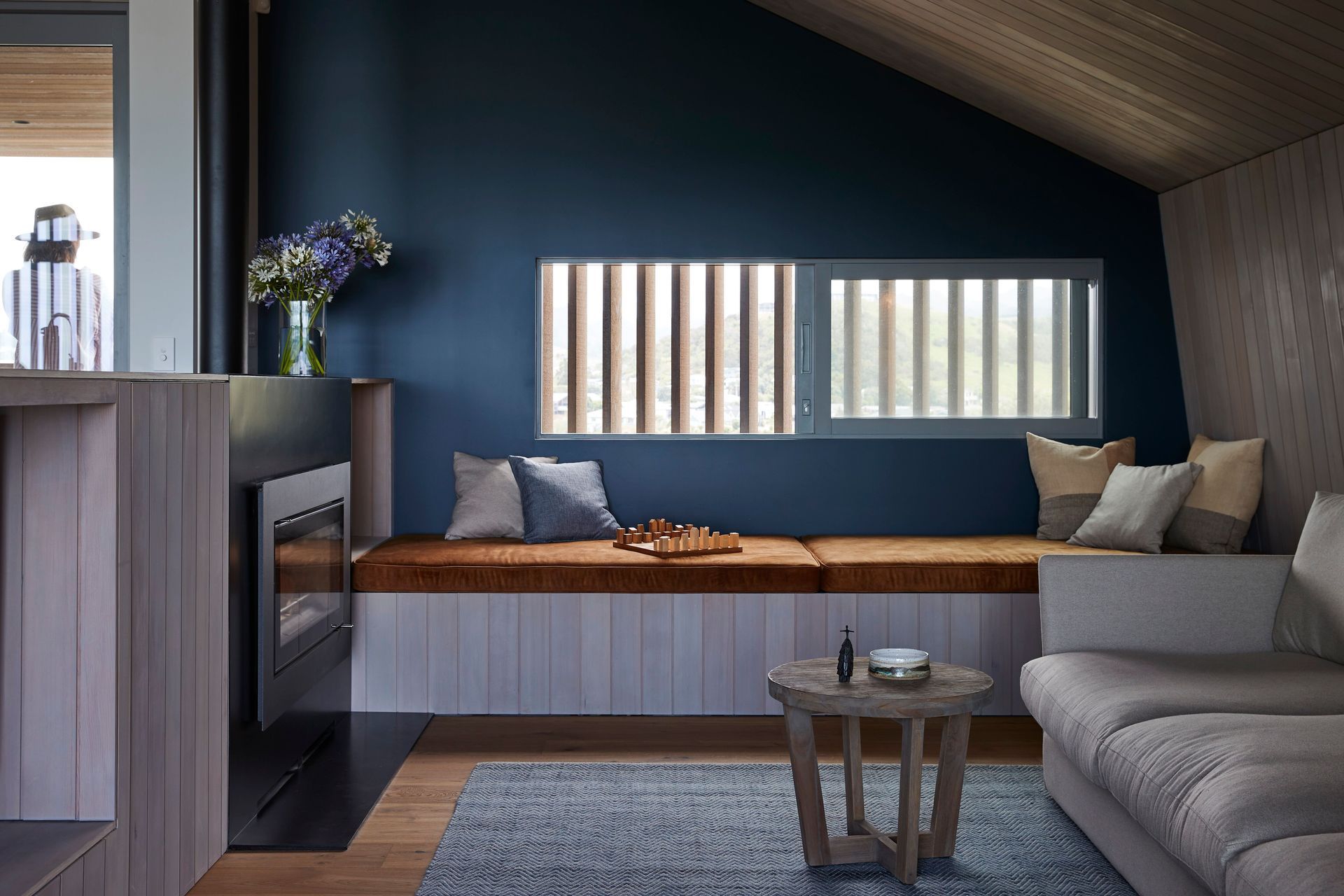 The snug lounge, a few steps down from the kitchen. | Photographer: Jackie Meiring