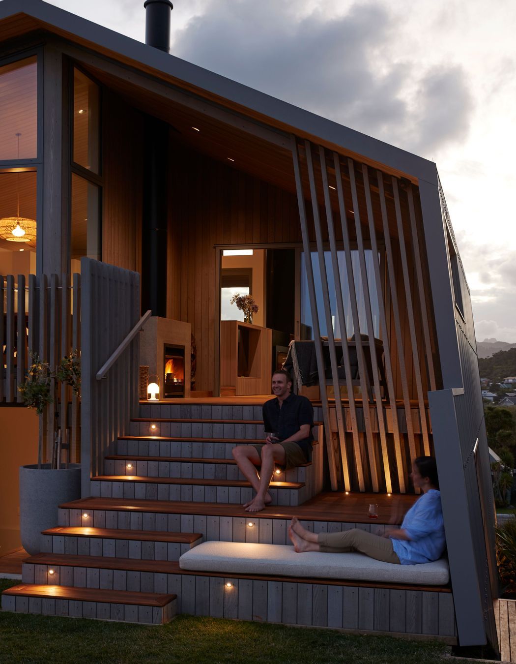 The eastern elevation, providing access to the ground floor's rumpus room and the upper floor's outdoor lounge. | Photographer: Jackie Meiring