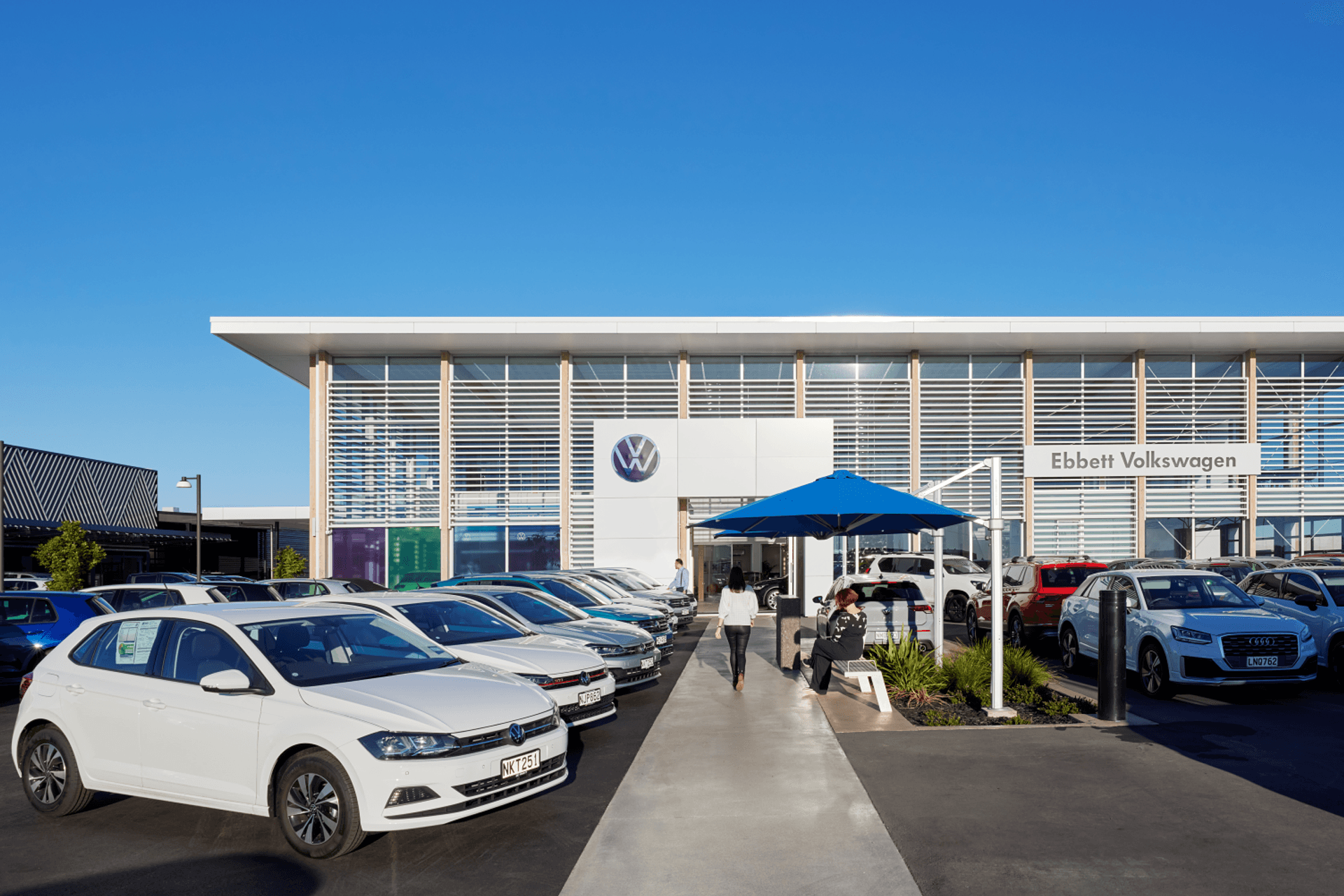 The Volkswagen dealership has a pale and Scandi-inspired design identity.
