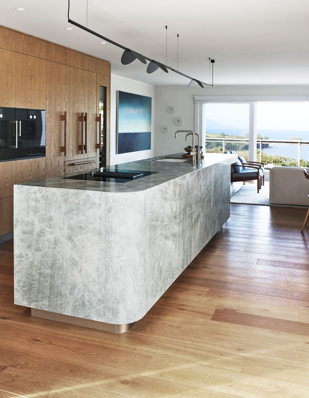 The view was the focus of the kitchen renovation. The light fixture was chosen as the cap details reminded Natalie of sea birds.