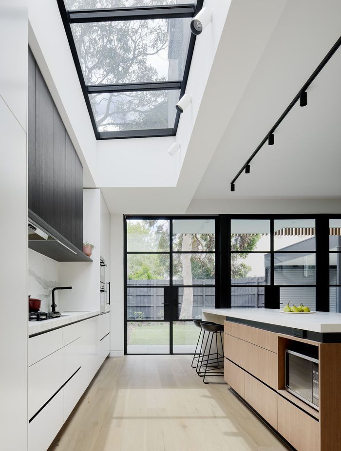 A skylight allows natural light to flow into the kitchen.