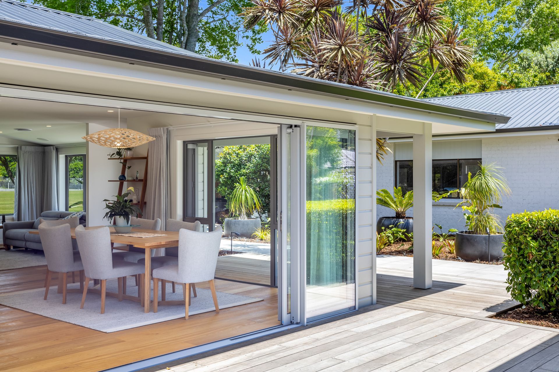 “We extended the main living area, adding two new structural portals to completely open up the living and kitchen space. New sliding doors were installed that lead out onto an ‘epic’ outdoor entertainment area, covered from the elements with louvres from LouvreSpan. This has essentially doubled the size of their living space!”