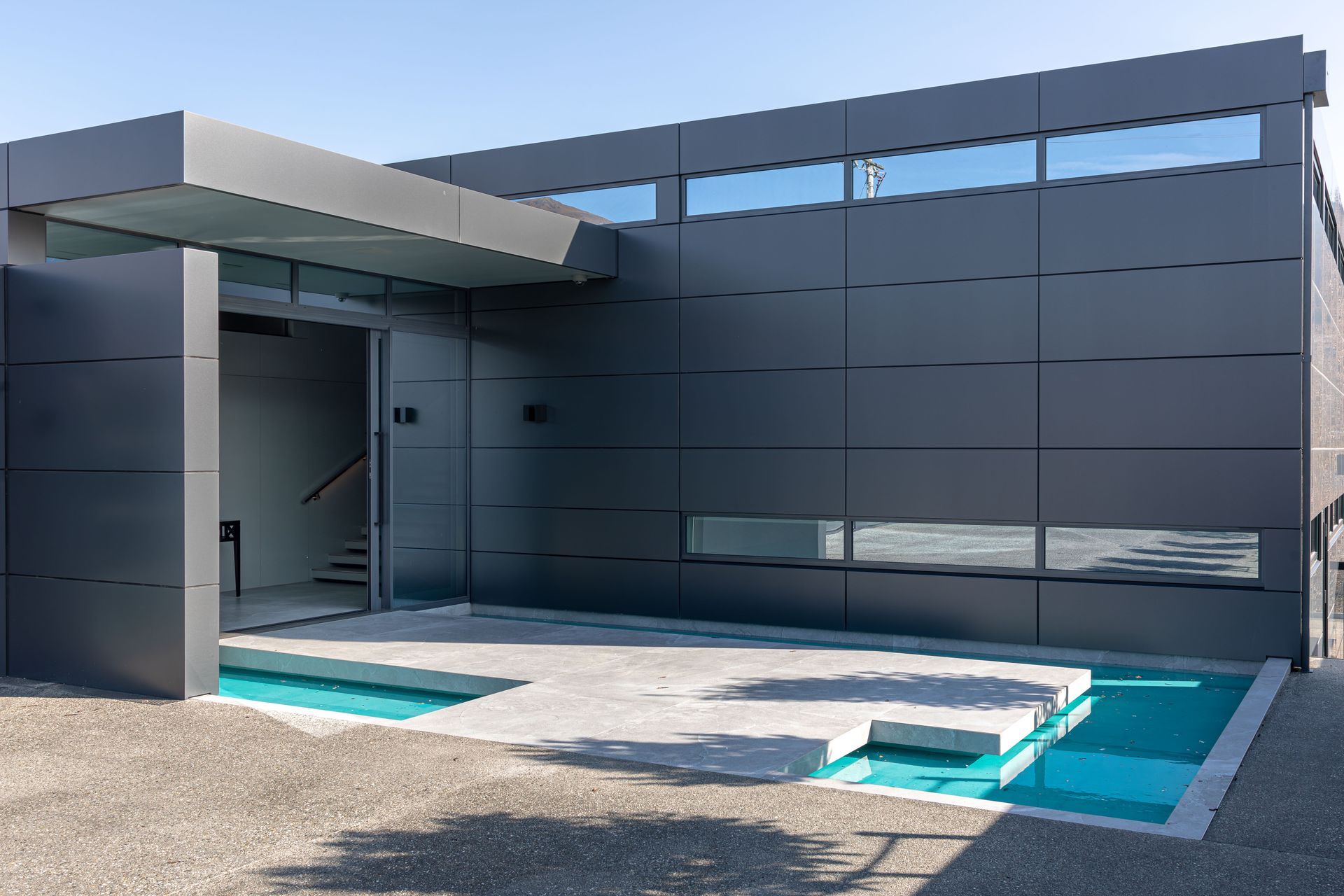 At the main entrance, a raised platform hovers over a pond, prompting a moment of reflection before continuing inside. The “reflection pond” is the first in a series of architectural water features curated to form a journey of sensory exploration.