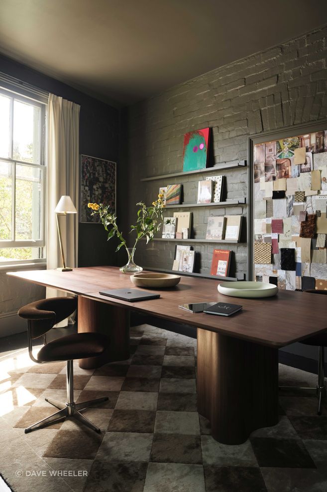 The workspace above is a moody creative sanctuary.