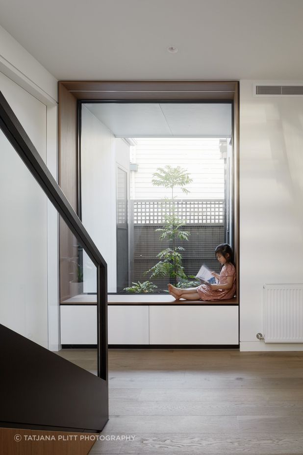 A reading nook with a large window overlooking an internal courtyard has been added where the extension meets the front of the home.
