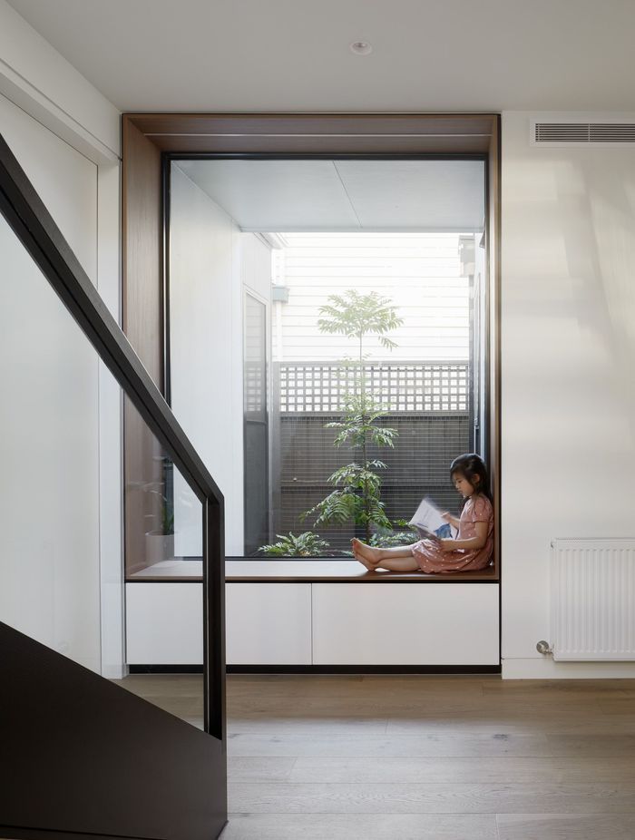 A reading nook with a large window overlooking an internal courtyard has been added where the extension meets the front of the home.