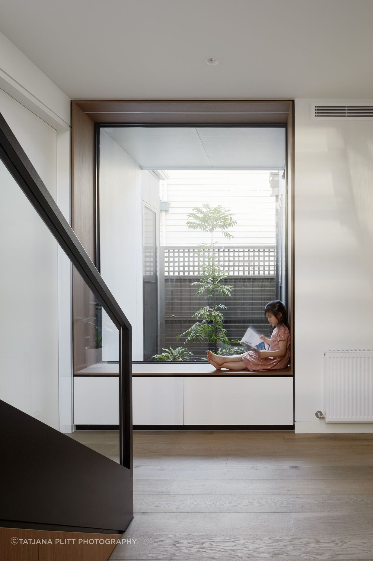 A reading nook with a large window overlooking an internal courtyard has been added where the extension meets the front of the home.
