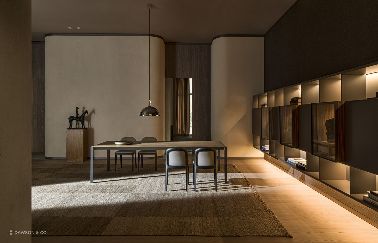 Statement rugs can provide a layer of comfort and style on hardwood surfaces, seen here with the exquisite Half A Square Dining Table by Molteni&C.