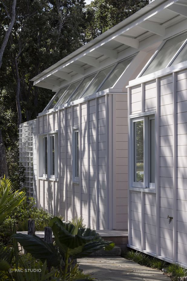 The home's exterior was painted a delicate sea shell pink, a nod to the seaside surroundings.