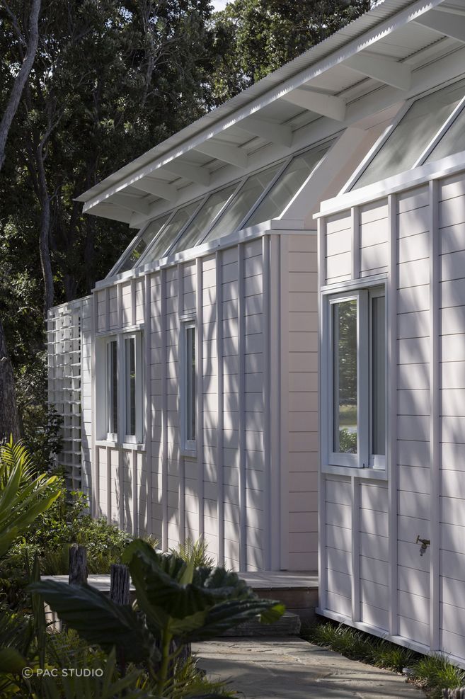 The home's exterior was painted a delicate sea shell pink, a nod to the seaside surroundings.