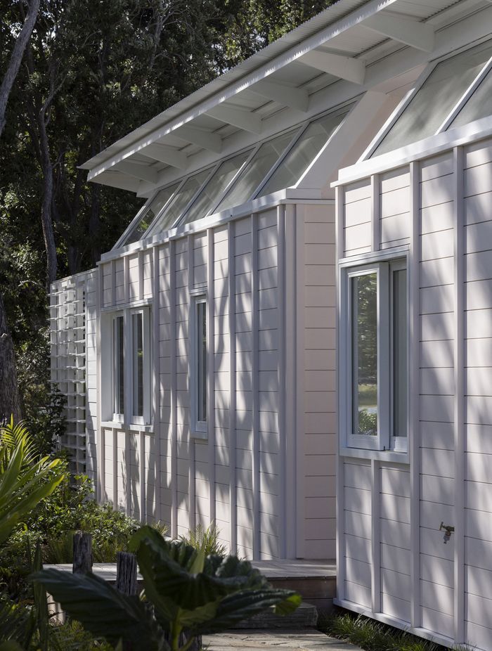 The home's exterior was painted a delicate sea shell pink, a nod to the seaside surroundings.