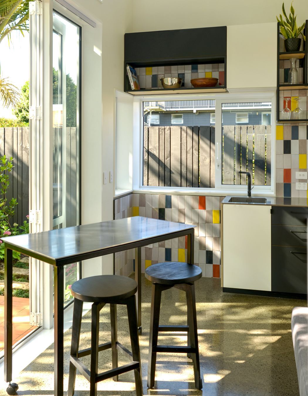 The kitchen, dining, and living space is designed to be multi-purpose.