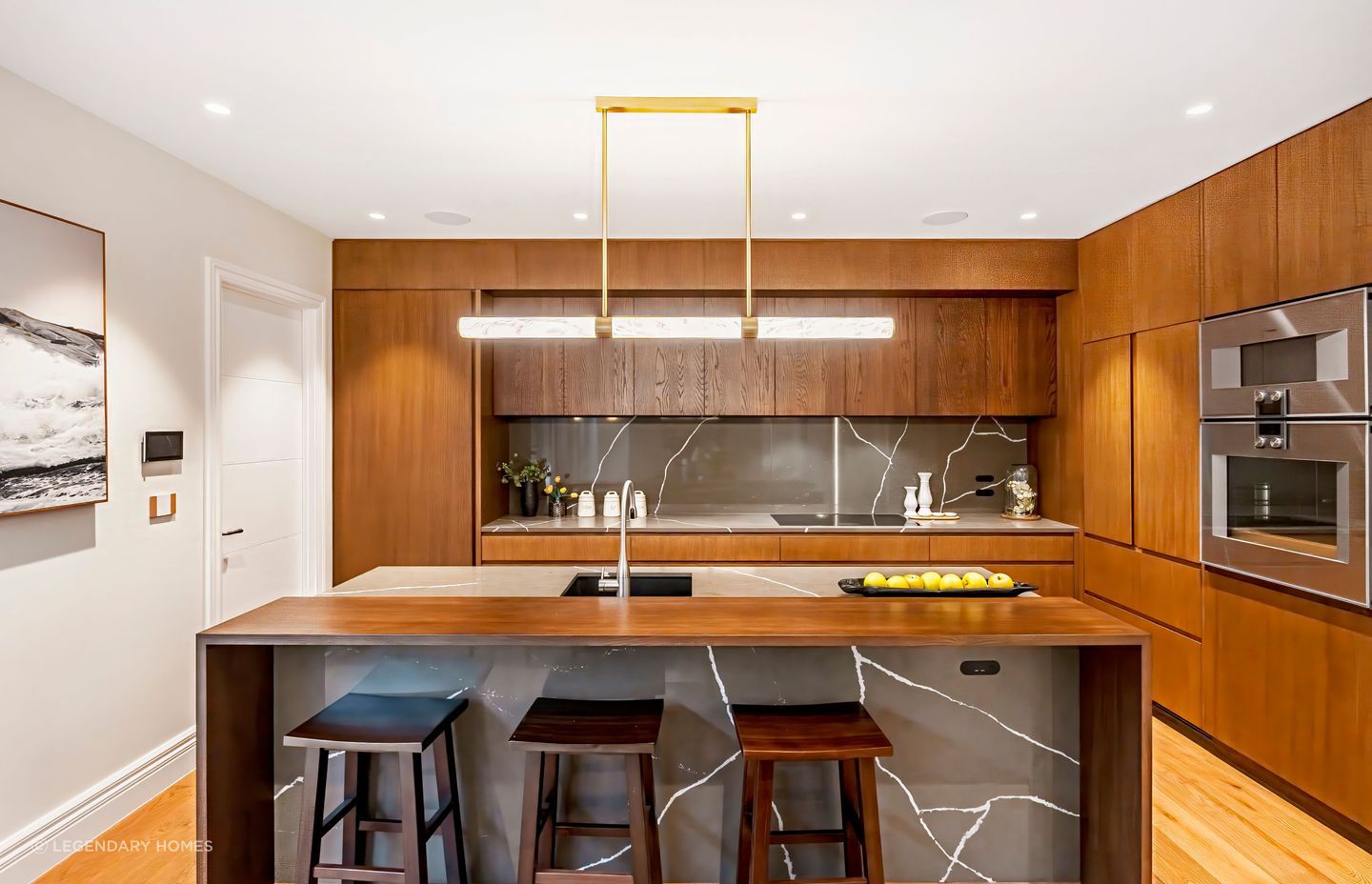 The full-height kitchen cabinet door on the left leads to the self-contained unit.