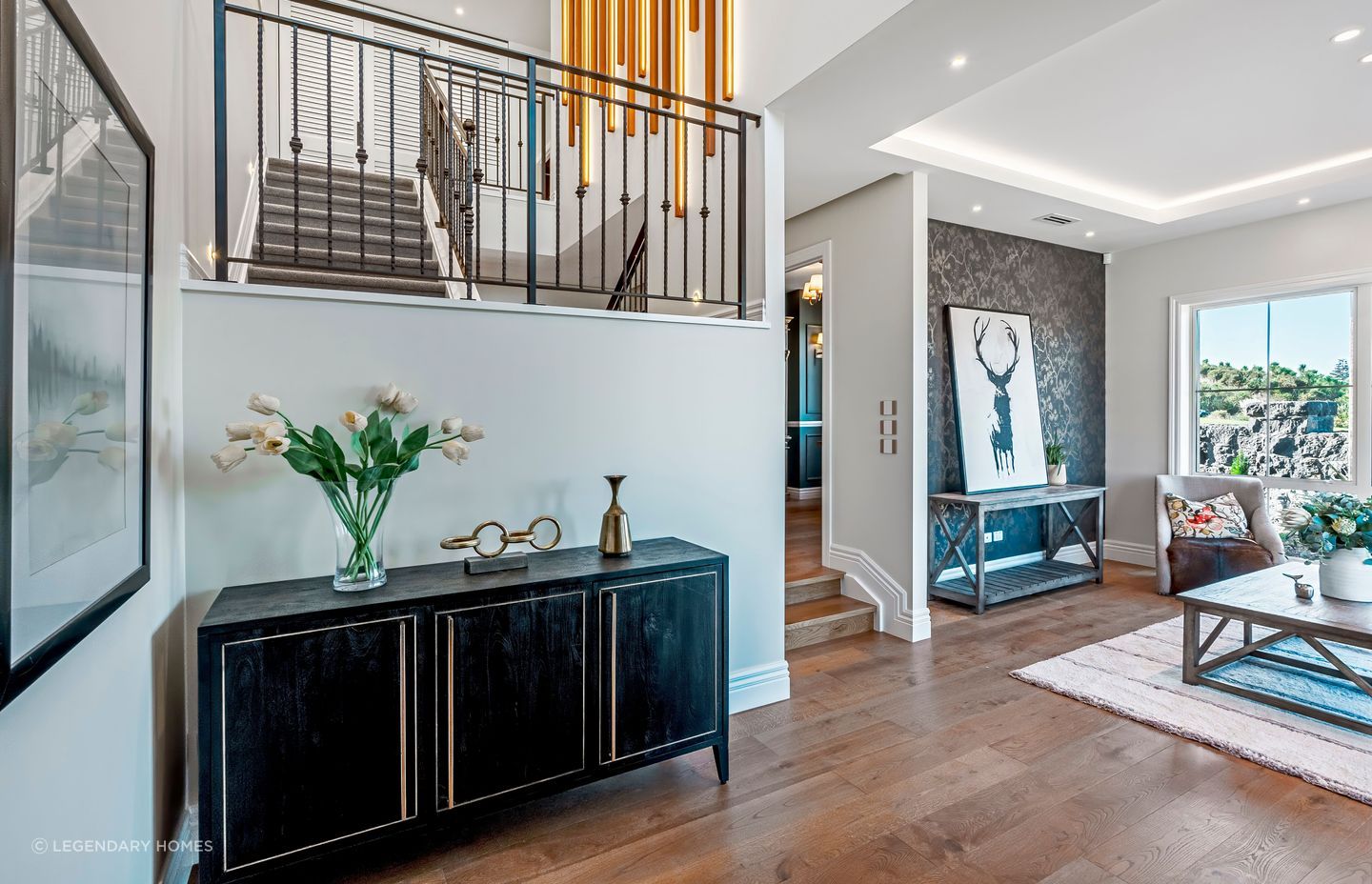 The foyer opens to a sitting area on the right.