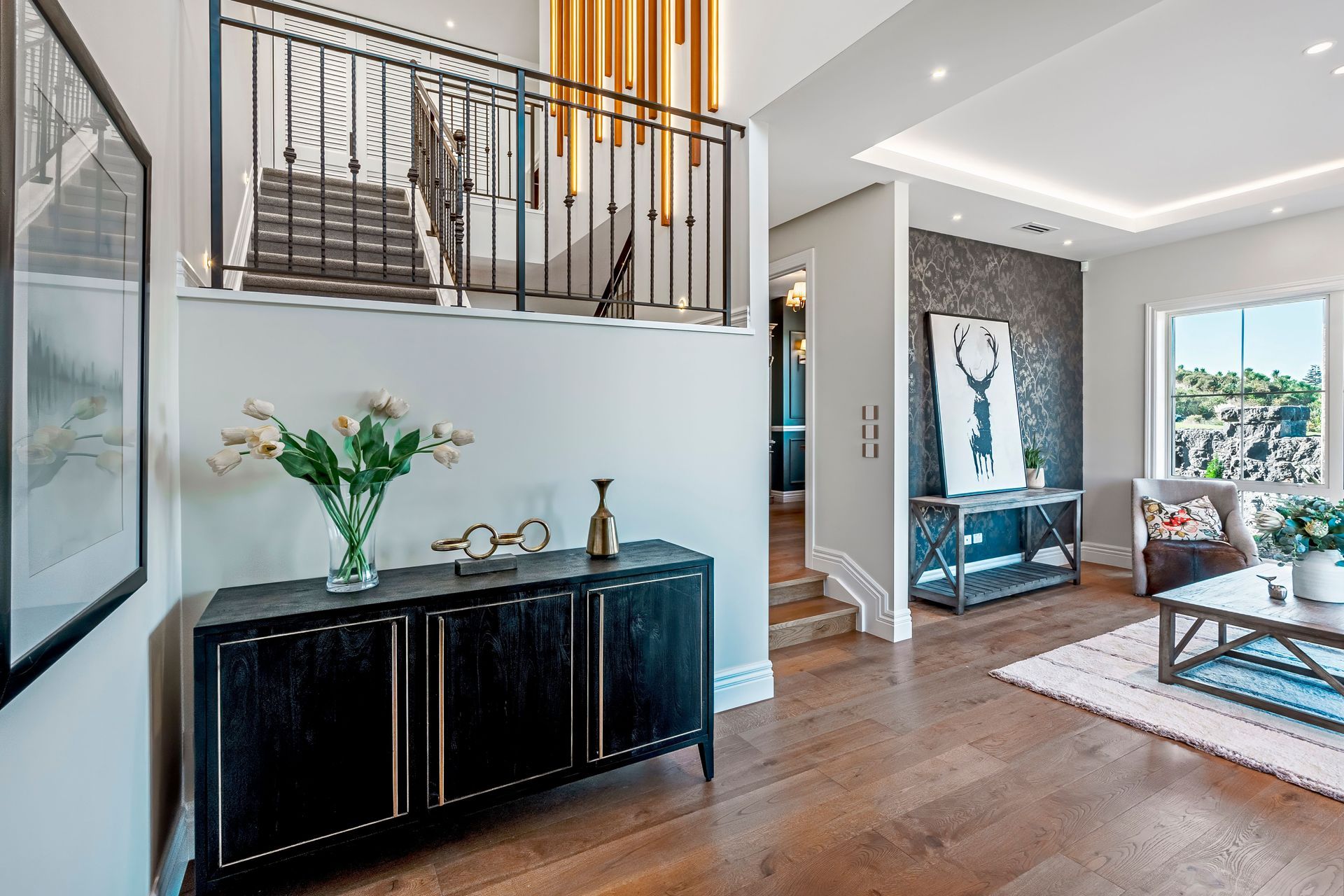 The foyer opens to a sitting area on the right.