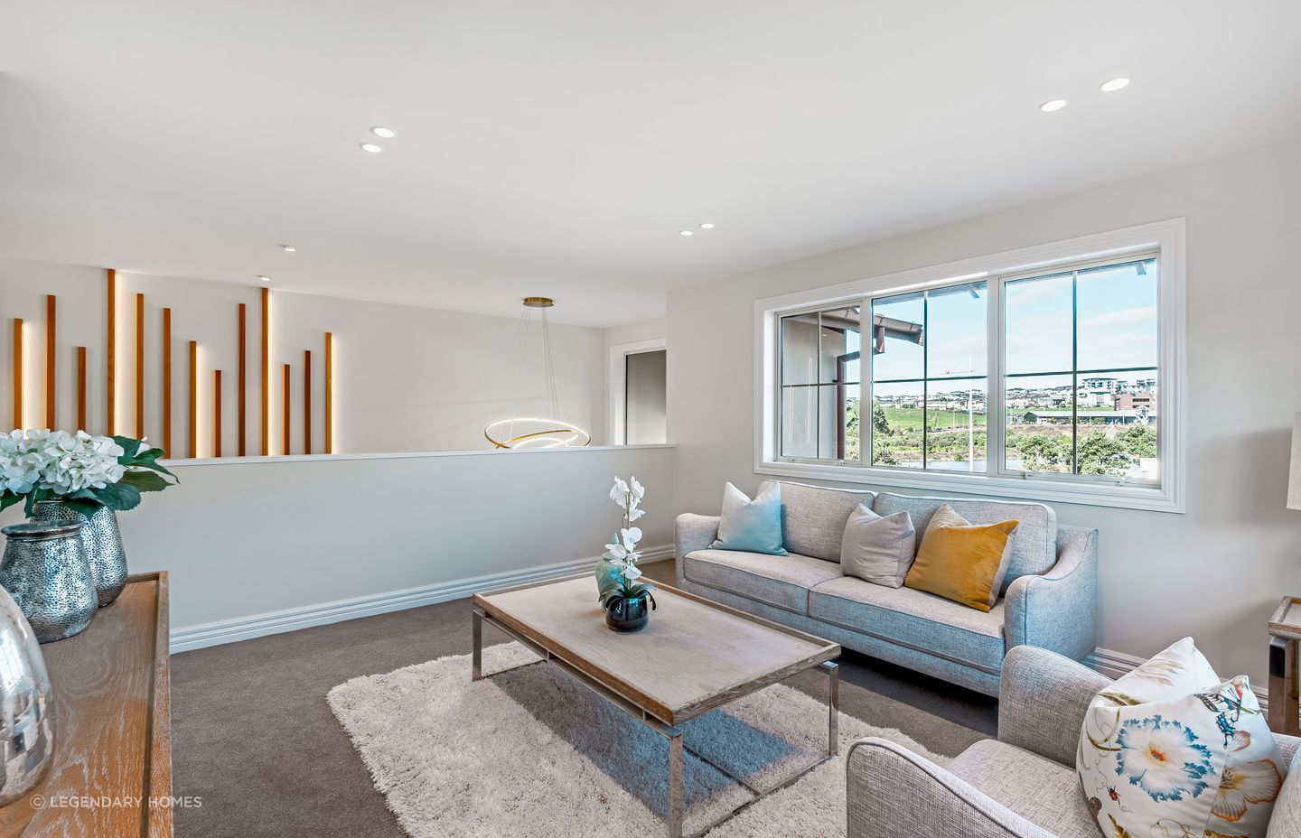 This second-storey living space offers versatility with the potential to be transformed into a media room.