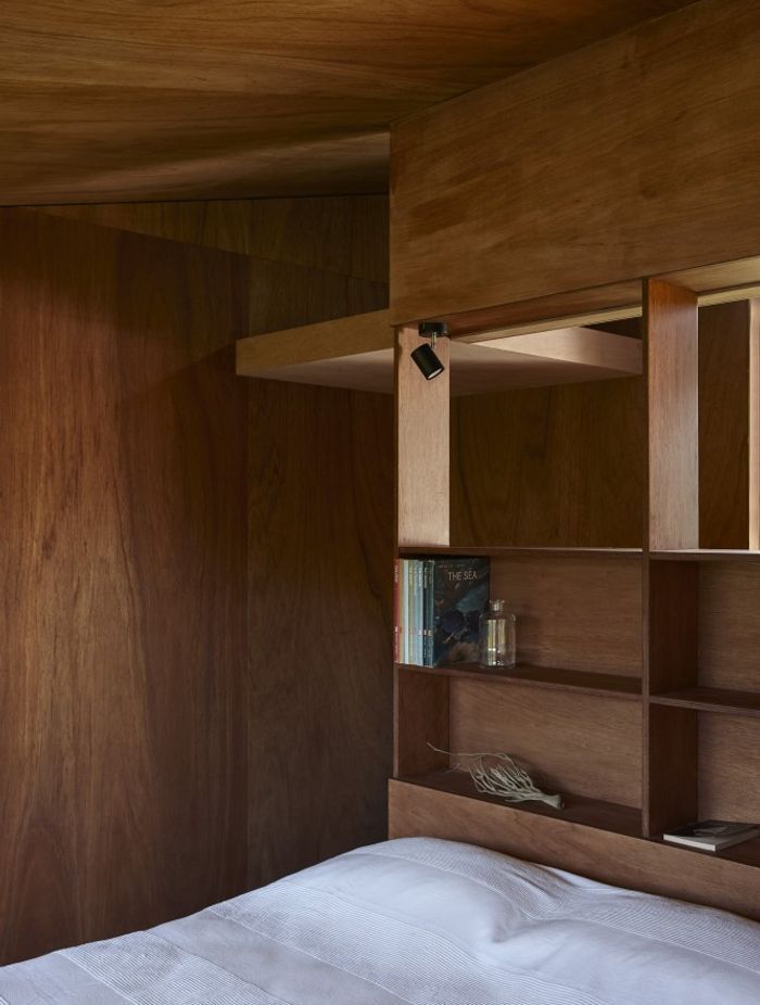 The sleeping pod features built-in shelving.