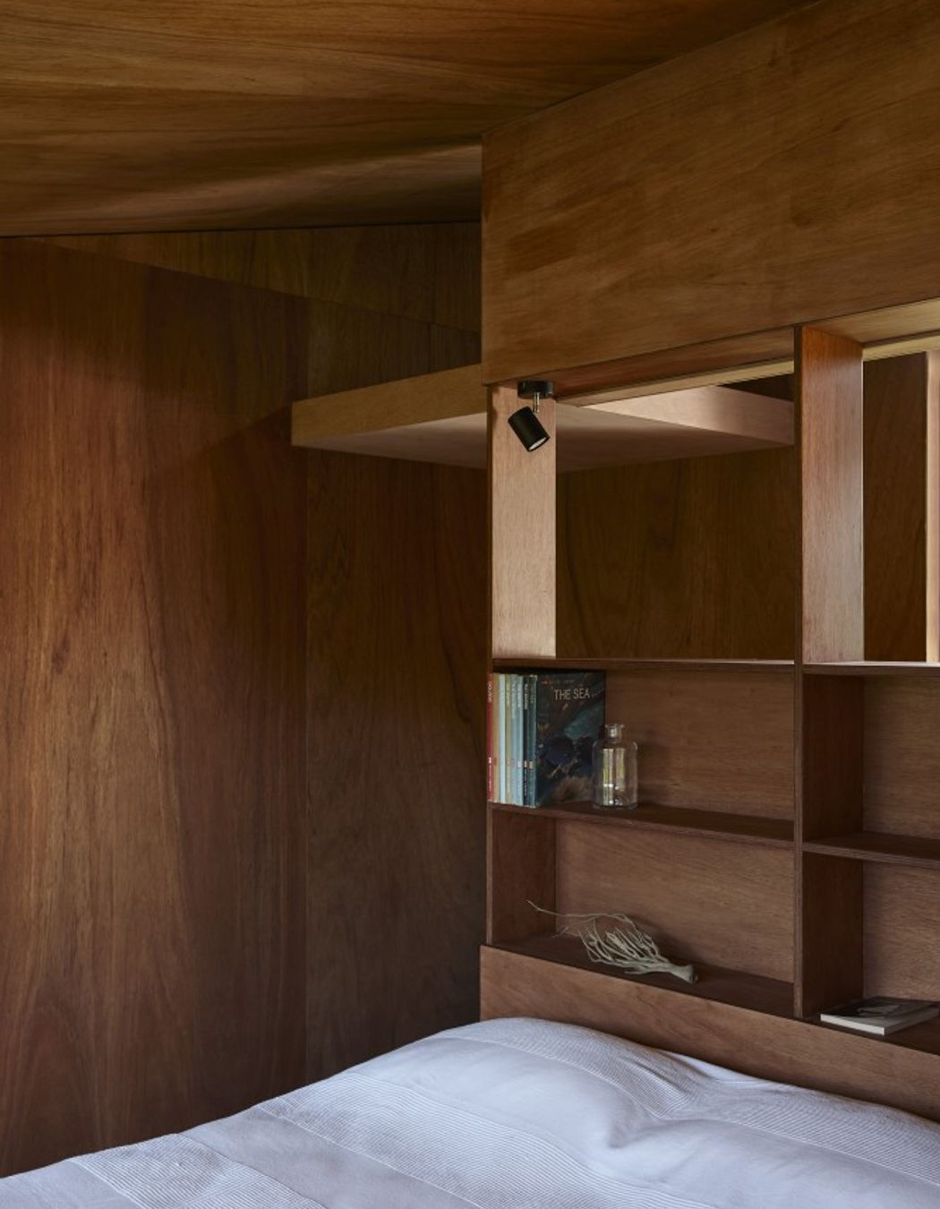The sleeping pod features built-in shelving.