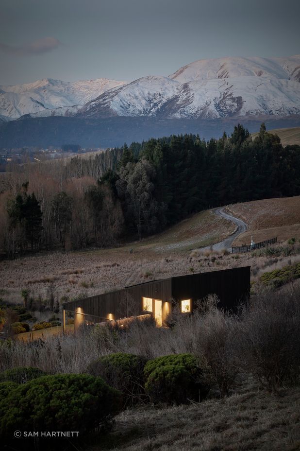 The wedge-shaped design follows the angle of the hill.