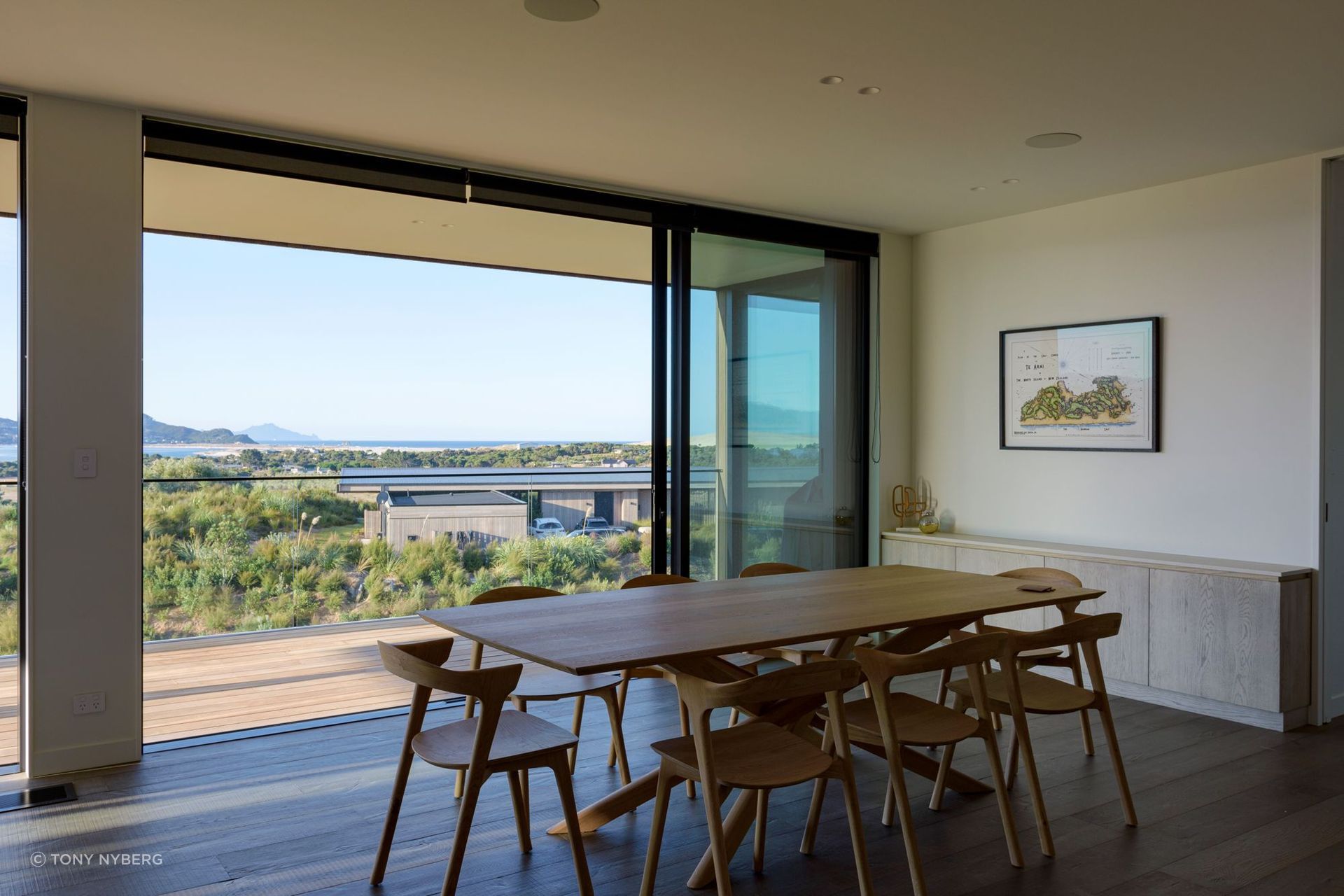 Extensive decking accessed by sliding doors allows the living and dining areas to open up to the outdoors.