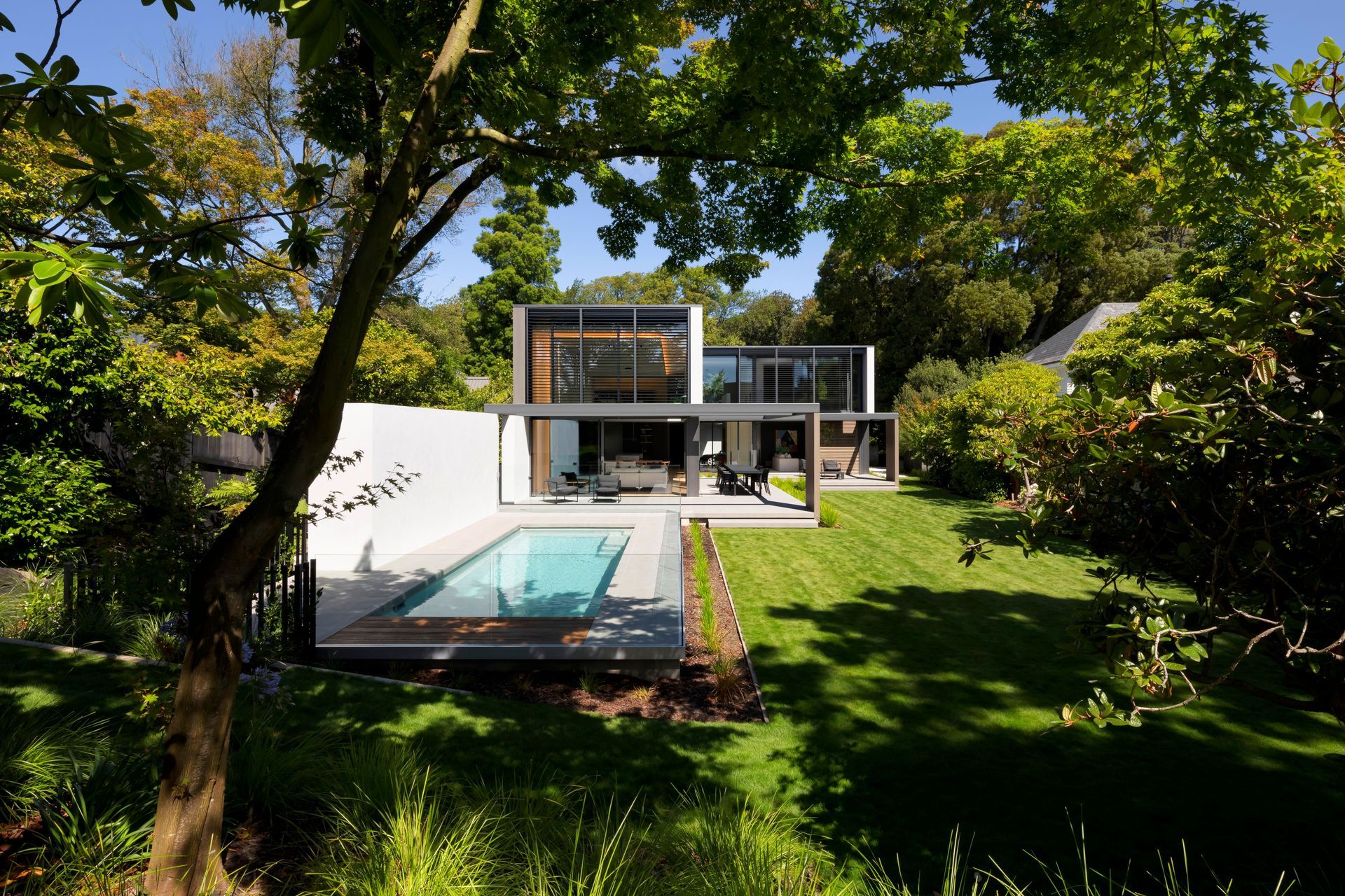 The home features an established garden, outdoor living space, and pool.