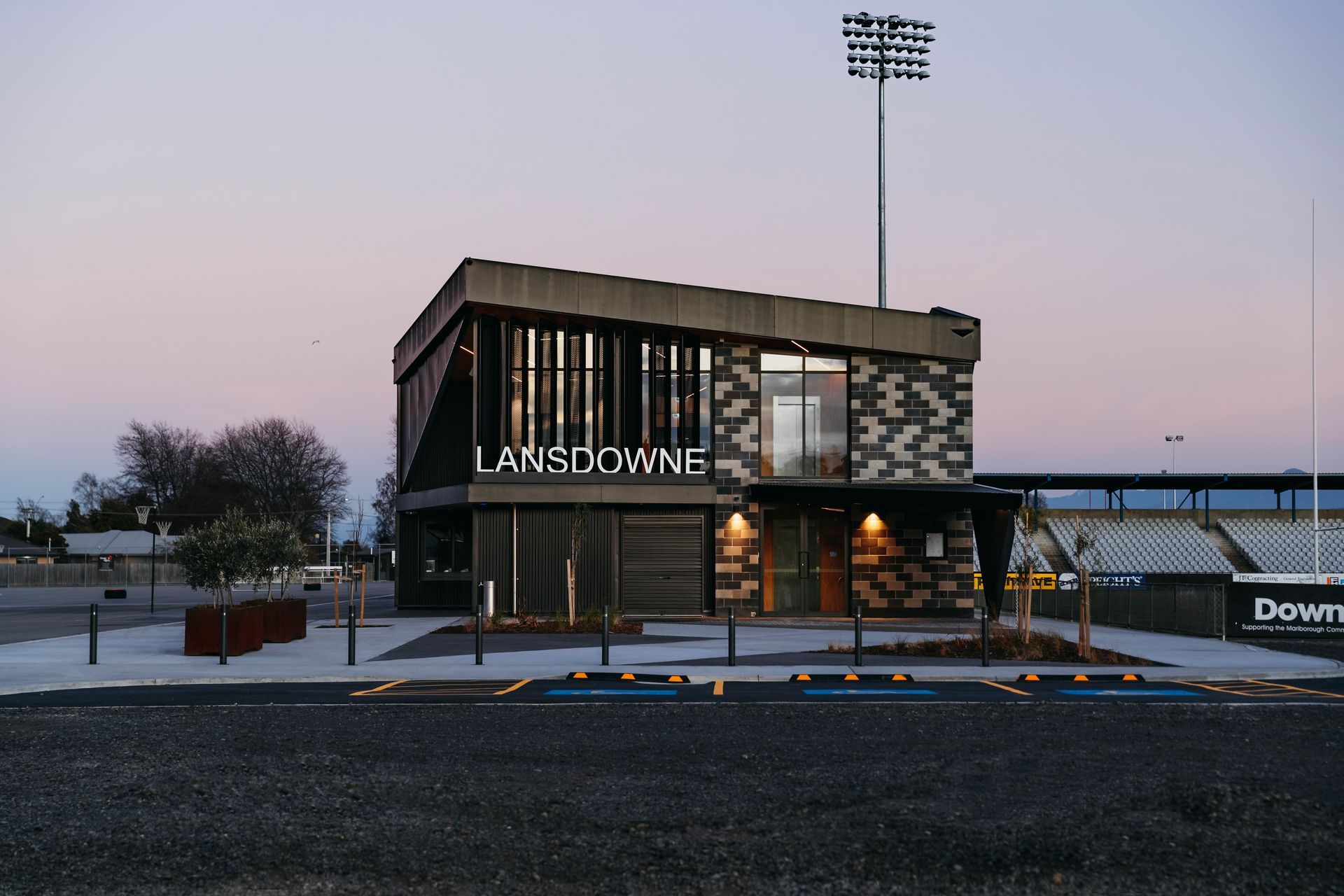 The entrance faces the car park, and the netball courts are found on the left, with the rugby field on the right.