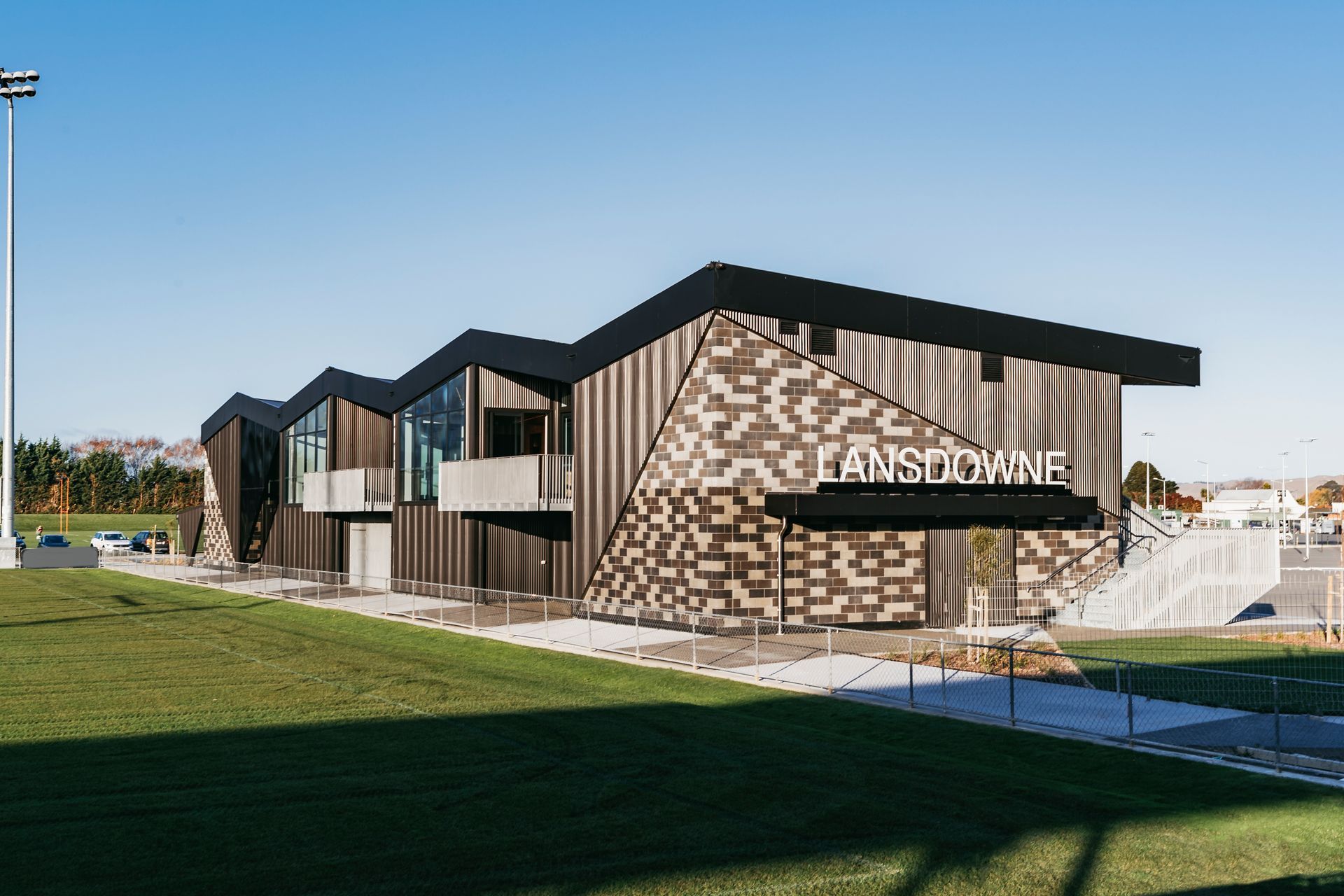 Each end of the building is bookended by angular ViBlock walls in a mixture of tones.