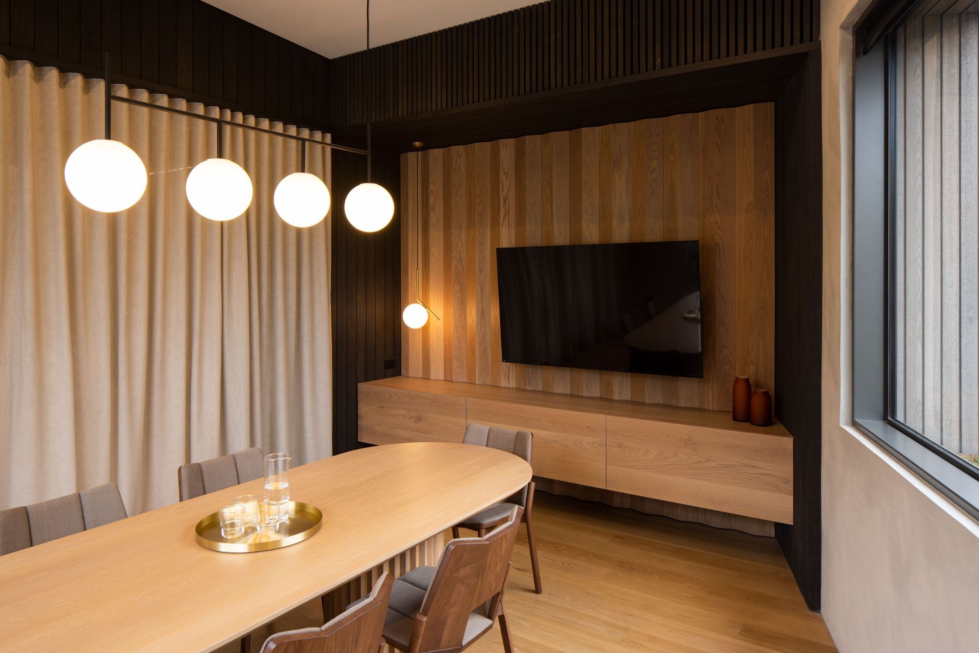 The boardroom table was custom designed to echo the faceted detail of the wall panelling. “We worked quite closely with the cabinetmaker on how that could be achieved,” says Roy.