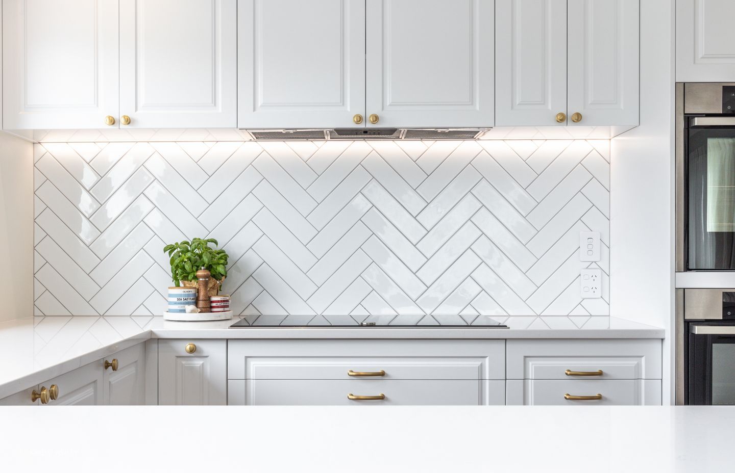 The kitchen is lit naturally by skylights.