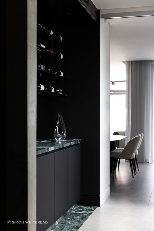 The wine bar is accented with Verde Alpi marble from CAV'ART Design Store.