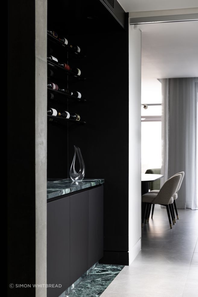 The wine bar is accented with Verde Alpi marble from CAV'ART Design Store.