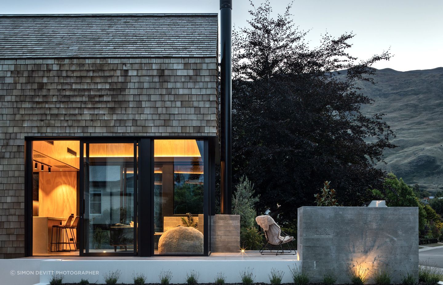 The cedar shingles are low-maintenance, ideal for the family that travels a lot, and the deck and glazing are perfectly designed to balance privacy while capturing views of Wanaka.