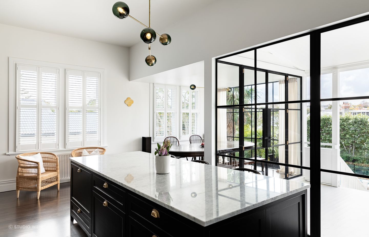 The glazing allows the kids to safely play on the back deck while in full view from the kitchen.