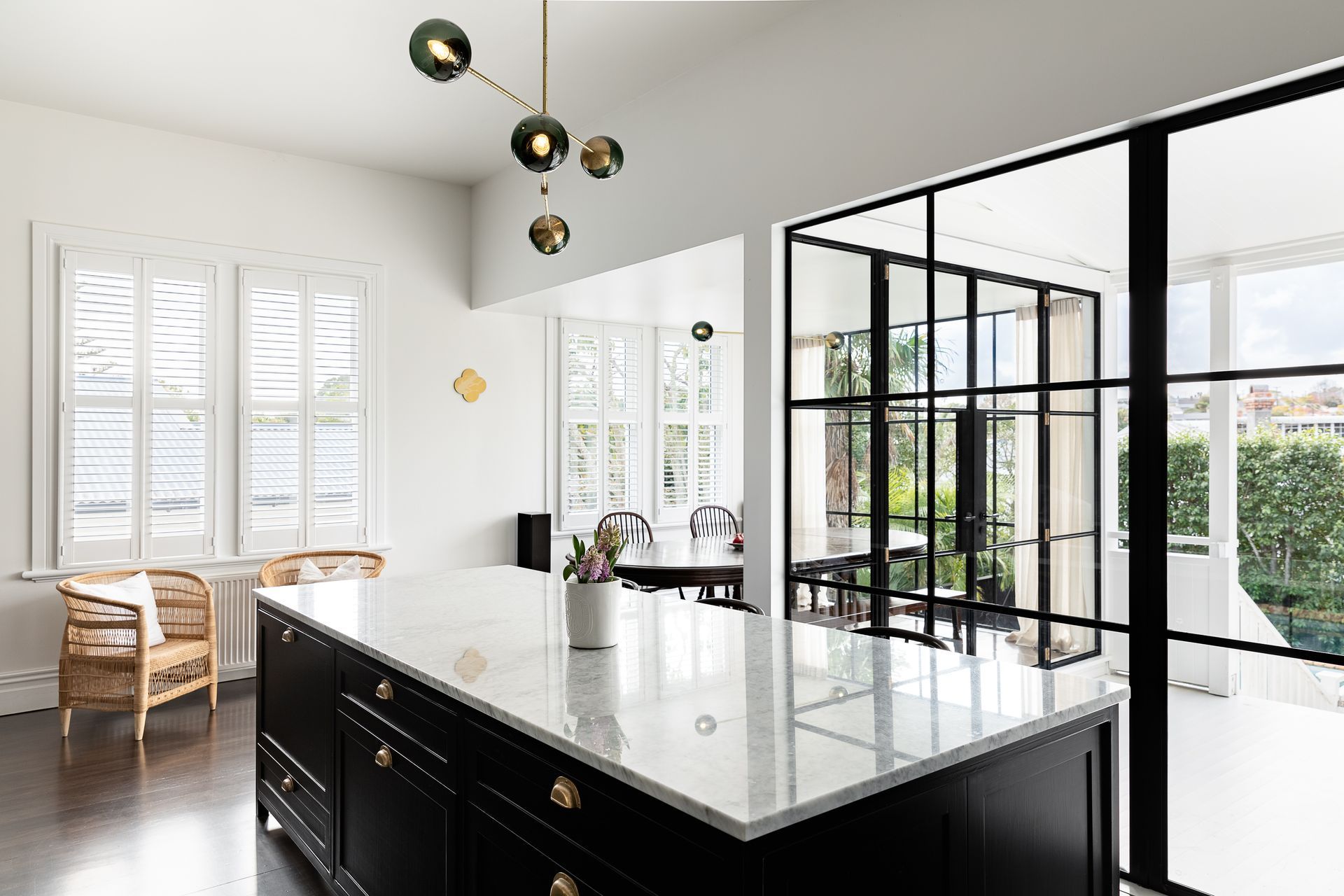 The glazing allows the kids to safely play on the back deck while in full view from the kitchen.