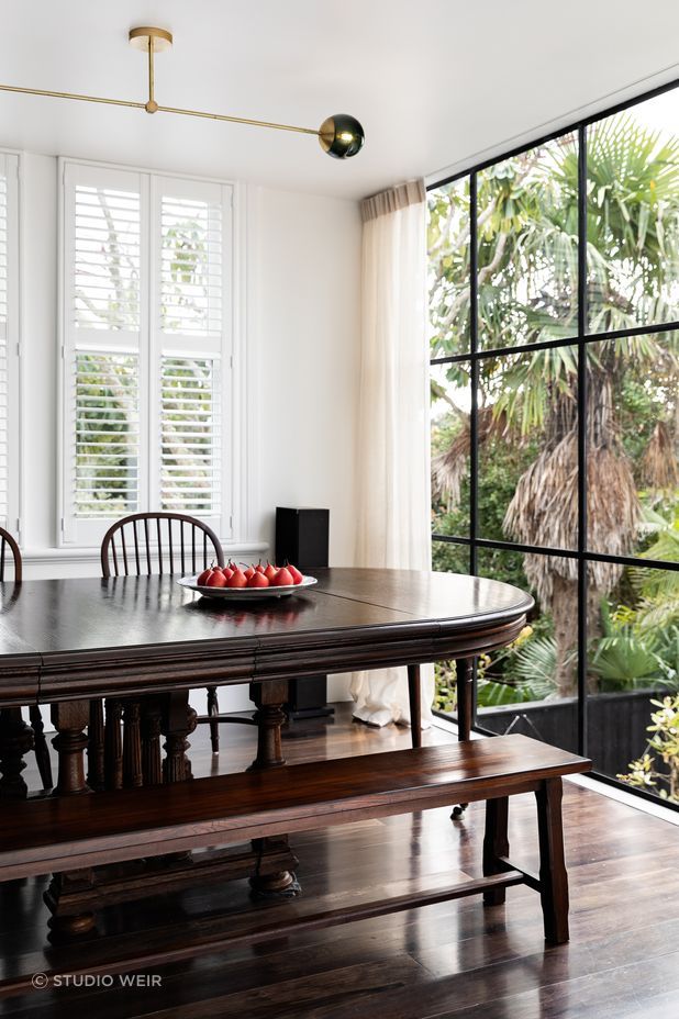 A French banquet table from John Stephens was the perfect fit for the dining room, which overlooks the brick salt water swimming pool.