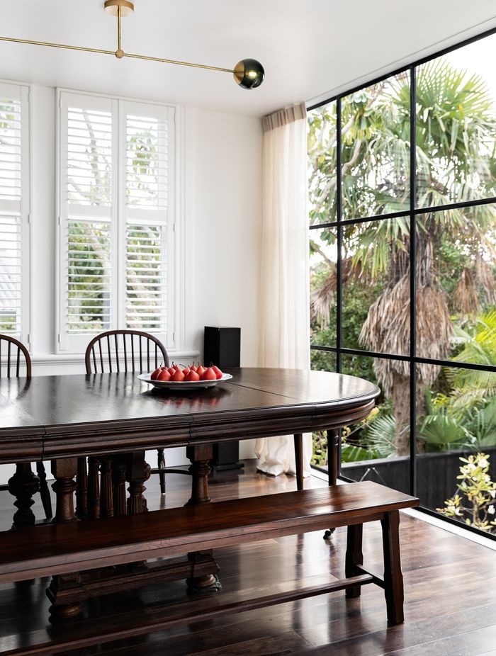 A French banquet table from John Stephens was the perfect fit for the dining room, which overlooks the brick salt water swimming pool.