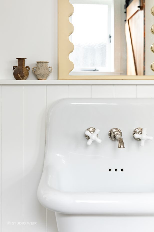 No attention to detail has been spared, with Perrin &amp; Rowe tapware also used in the downstairs bathroom and the curved mirror detailing a nod to the mirror in the children's bathroom.