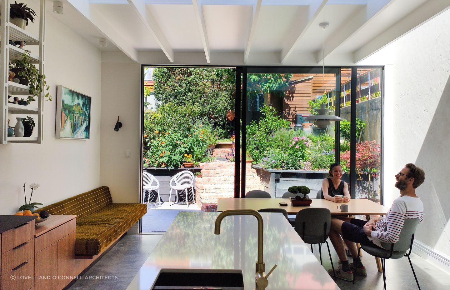 Fantastic interior design allows this lush back-garden courtyard to act as an extended dining and living space.