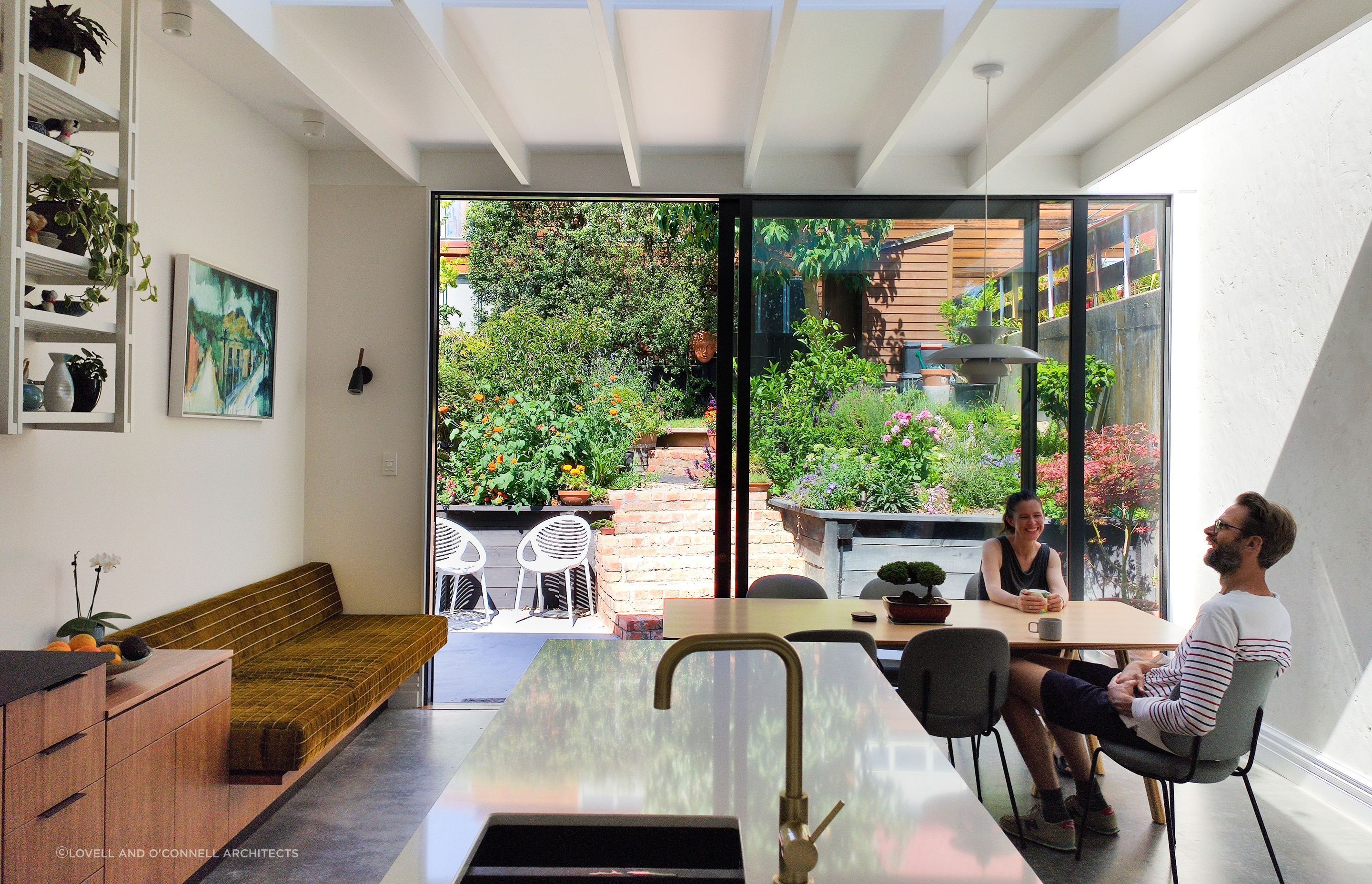 Fantastic interior design allows this lush back-garden courtyard to act as an extended dining and living space