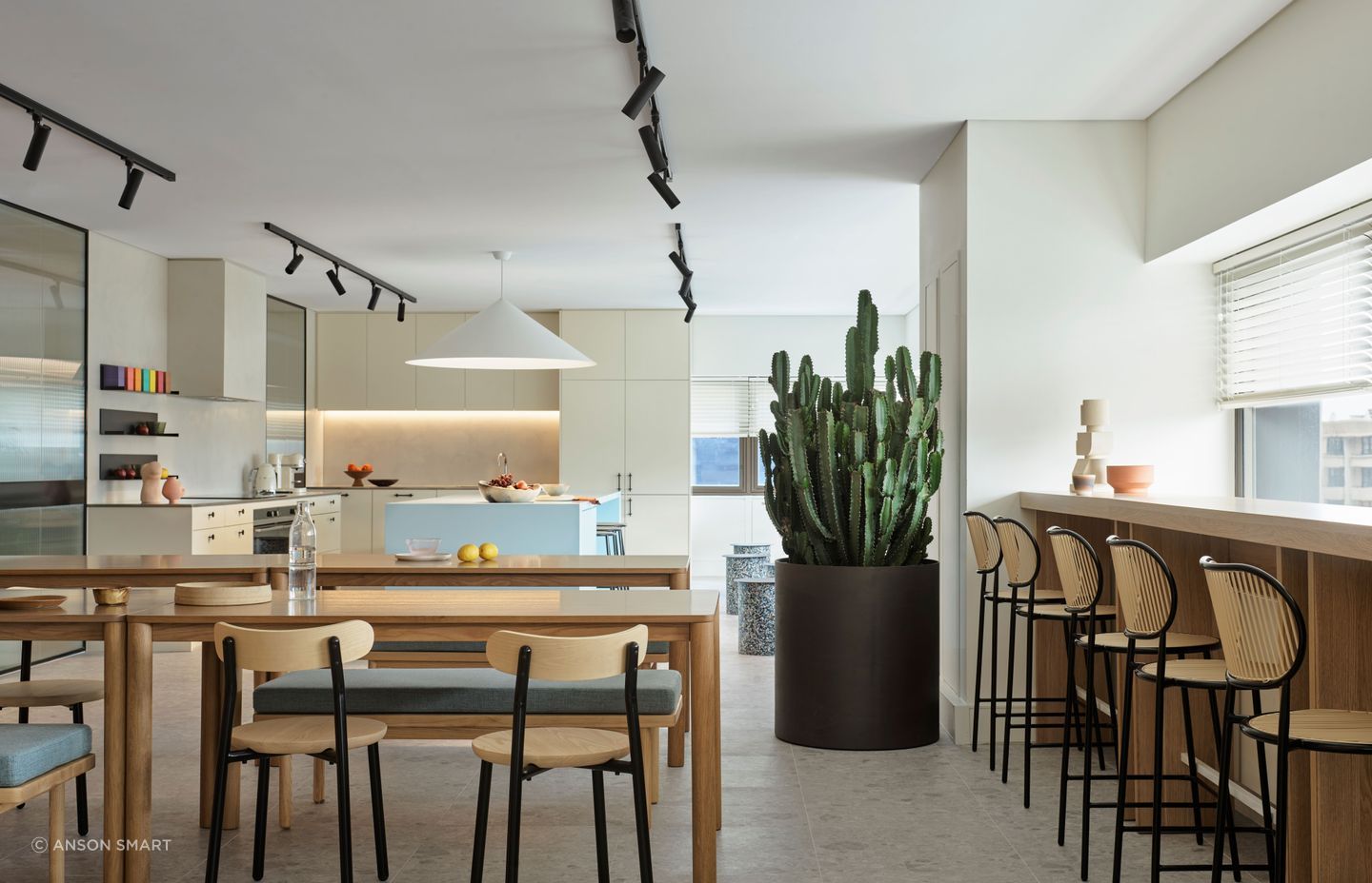 Familiar domestic shapes like bentwood stools and timber tables were used to make the kitchen feel cosy and inviting.