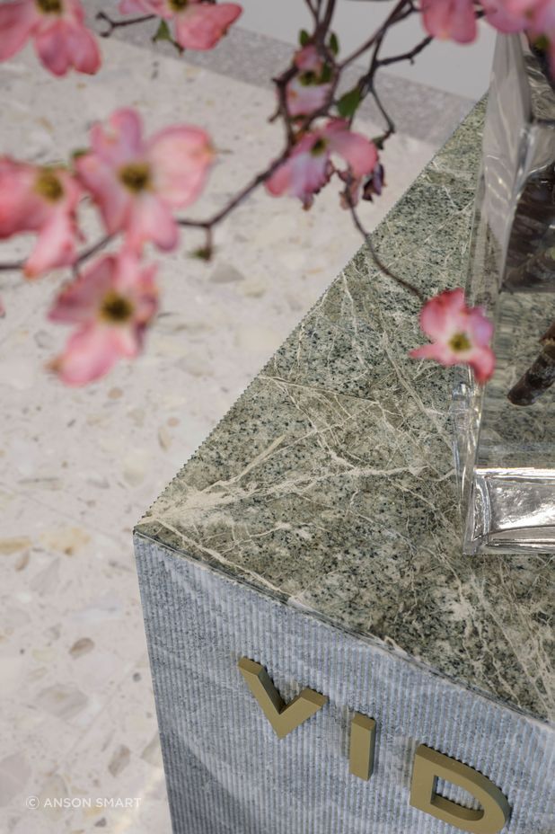 The stunning parsley green stone of the 'collagen bar' is ribbed on the sides, but flat and shiny on the top surface.