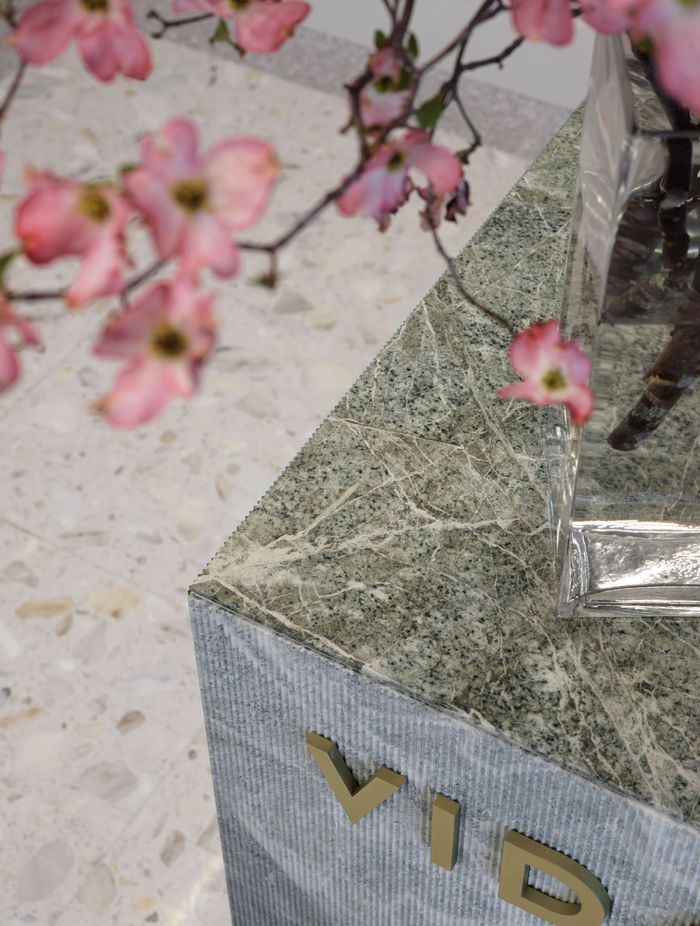 The stunning parsley green stone of the 'collagen bar' is ribbed on the sides, but flat and shiny on the top surface.