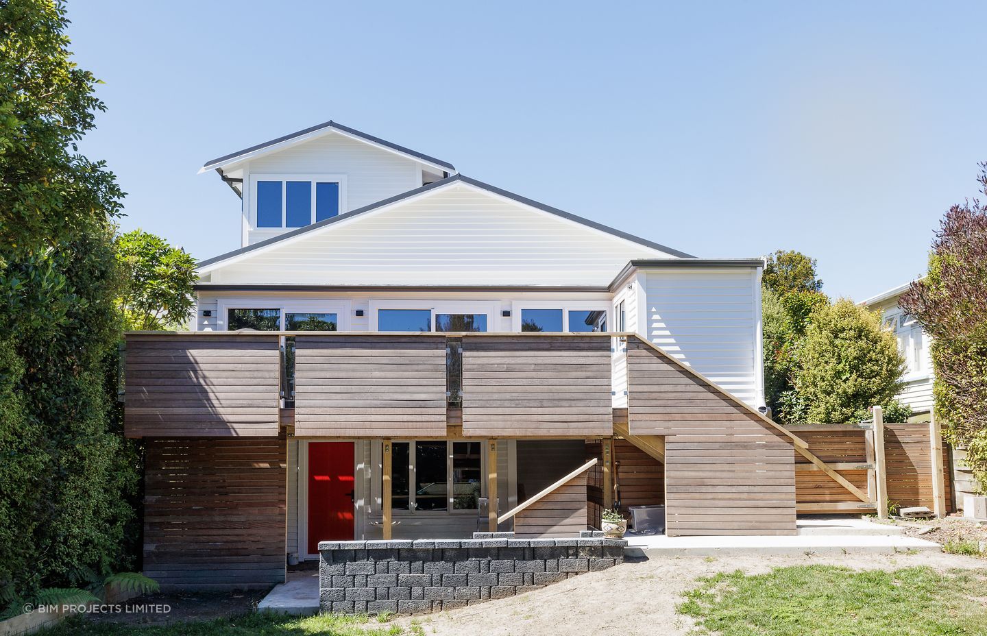 The home received a full transformation, from front to back. The hardwood deck has been a welcome addition for the clients.