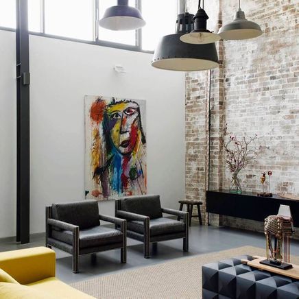 Raw materials and a refined palette transformed an industrial warehouse into a contemporary home