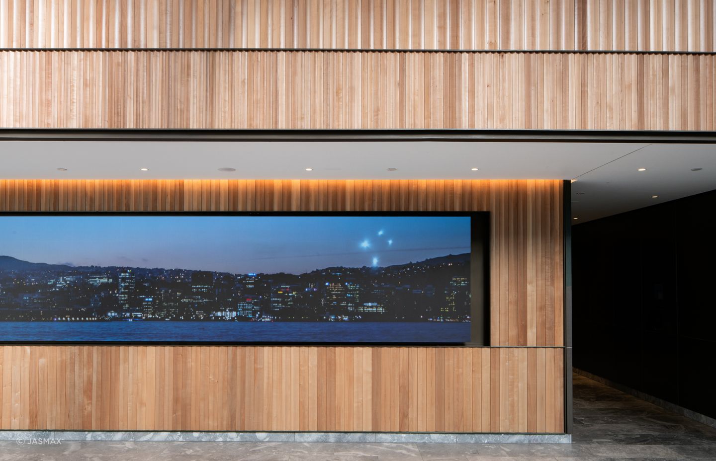 The interior architecture of the public spaces includes timber, brass and marble finishes.